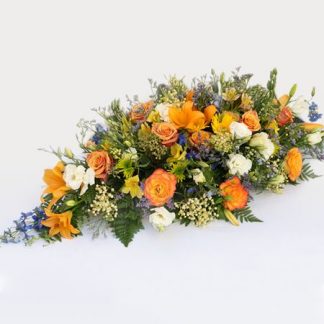 Multicolored coffin arrangement
