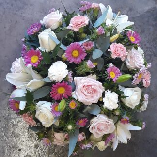 Pastel round funeral spray